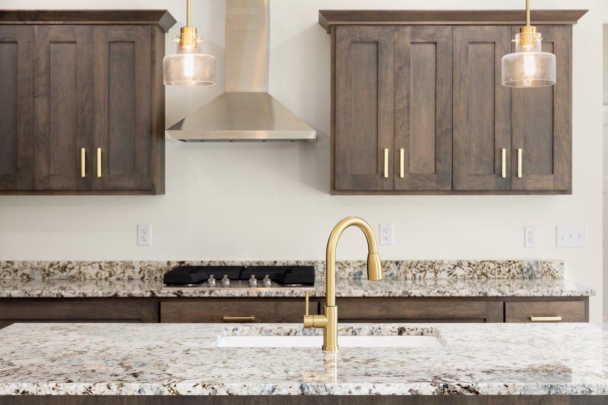 Luxury kitchen detail with gold faucet