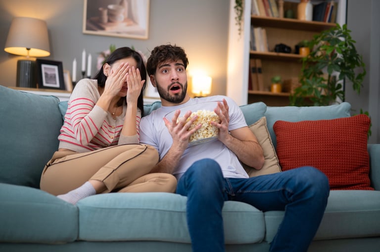 Couple enjoying movie night entertainment space